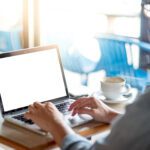 Man uses a laptop for remote working