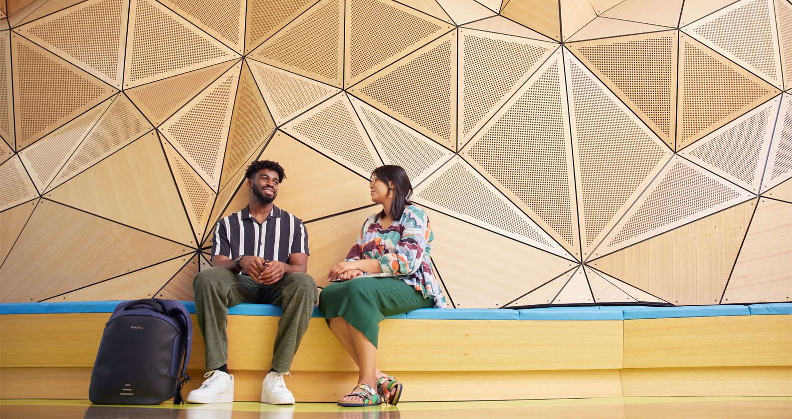 Two students sitting on campus