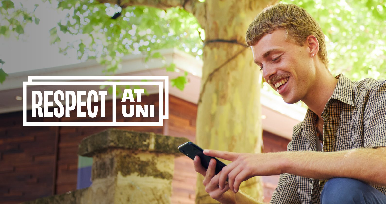 A student smiling at his phone with the Respect at Uni logo.