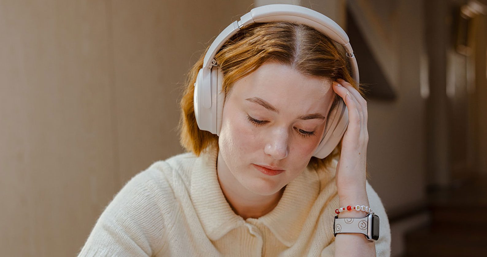 Student wearing headphones studying.