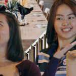 Devna and Celena smiling against the backdrop a banquet hall.