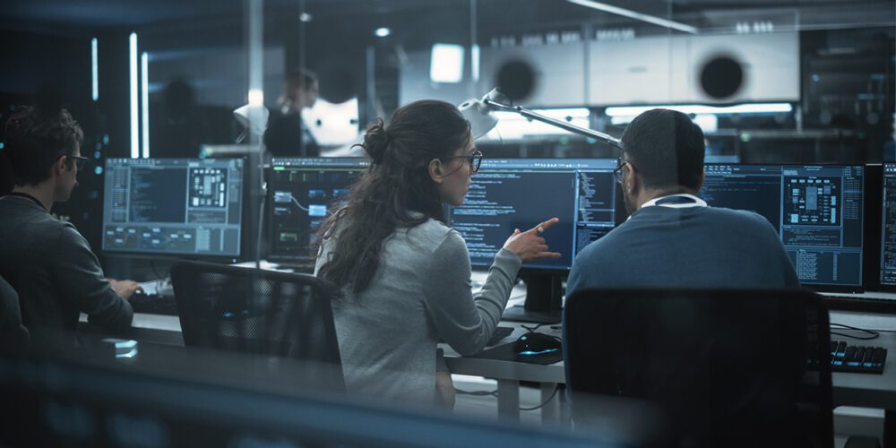 Two Curtin University students in an IT lab, learning about software development.