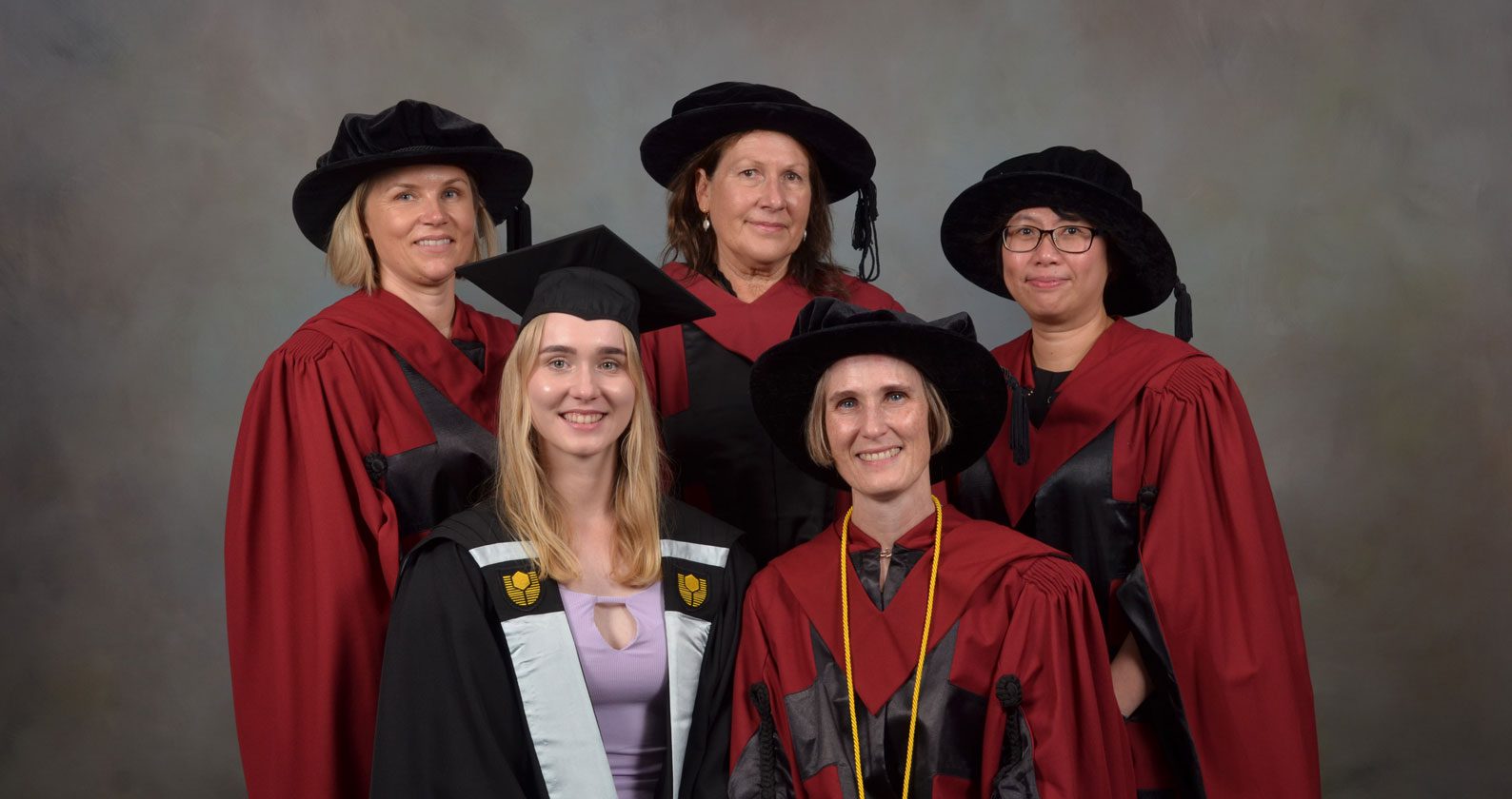Felicity surrounded by her daughter and supervisors.