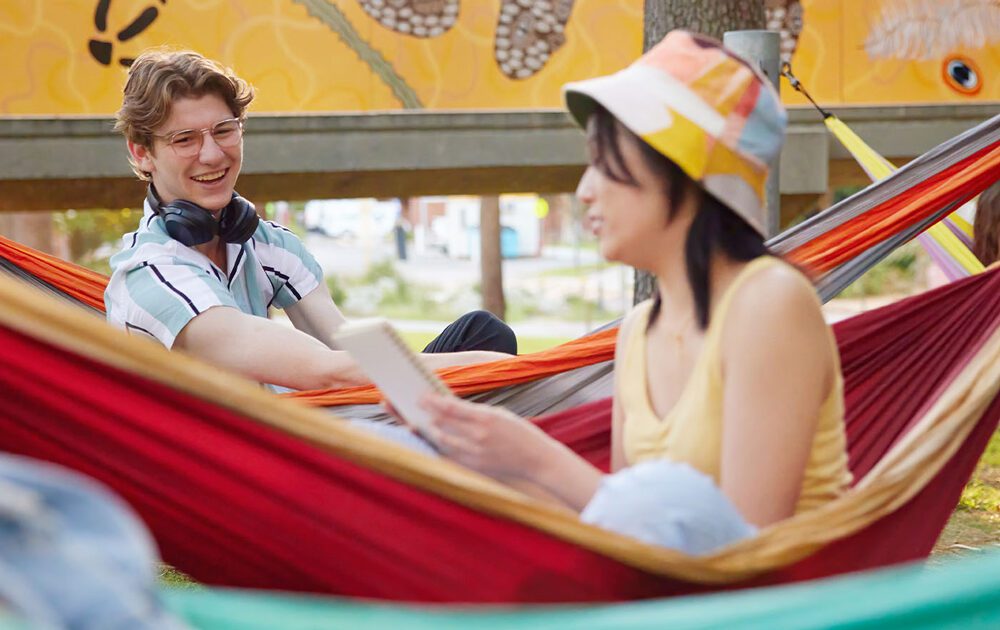 Students relax in hammocks at Curtin Perth