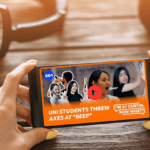 Someone holding an iPhone with the latest I'm At Curtin Now What video playing.