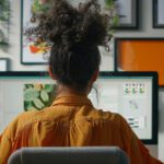 Student facing their computer, creating an online portfolio