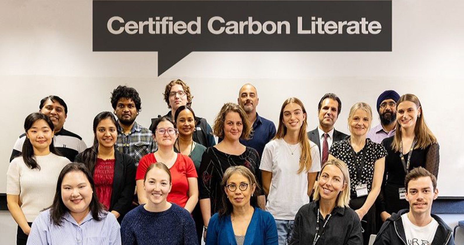 Students who participated in the Carbon Literacy Program standing together for a group photo