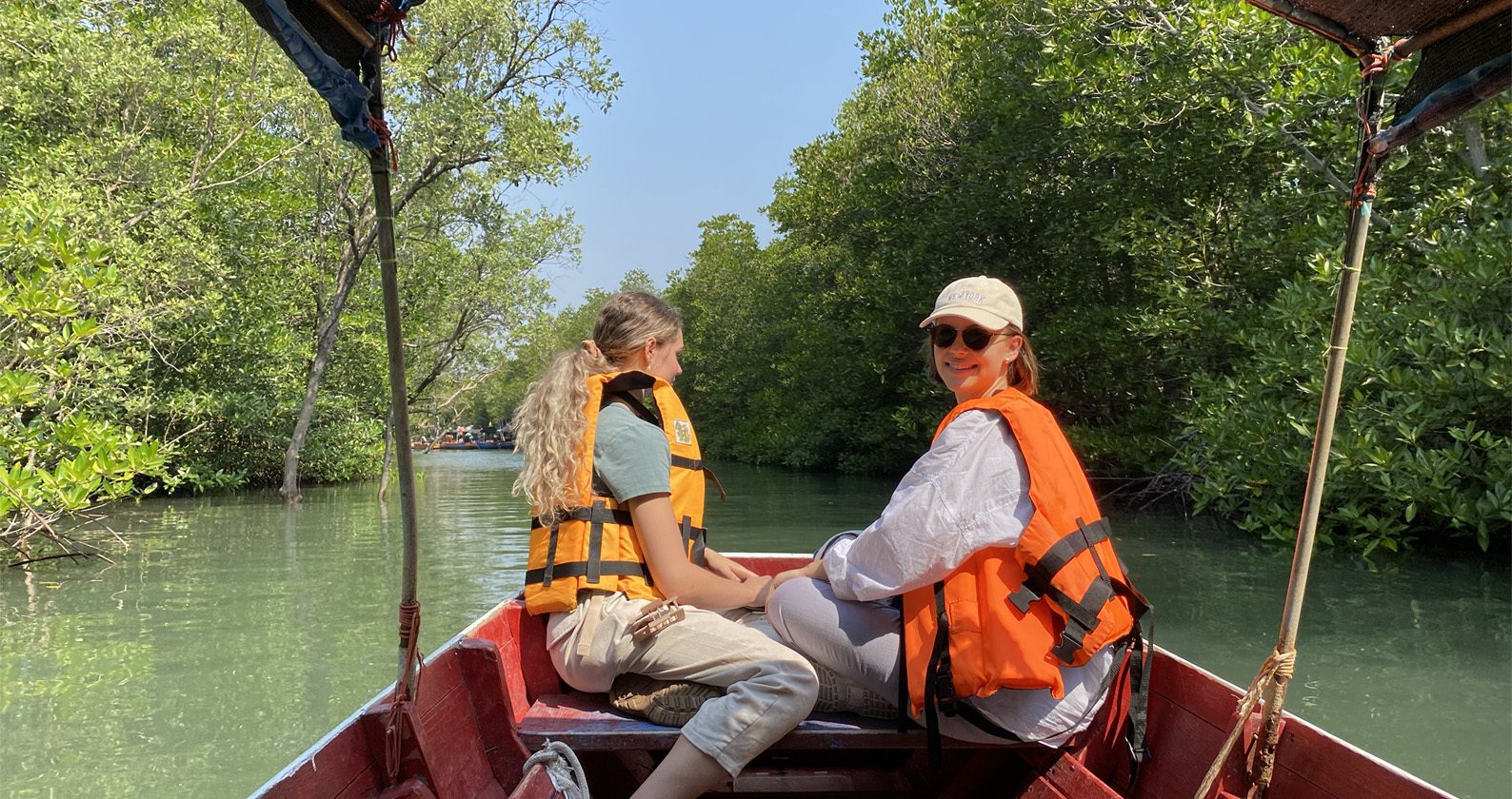 Two students on a boat in Thailand thanks to the New Colombo Plan