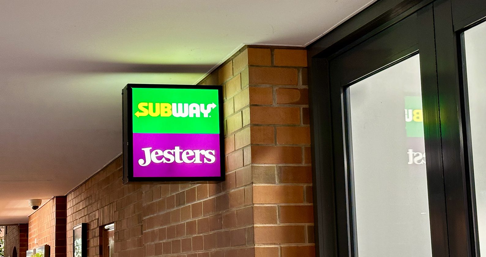 Jesters & Subway sign on campus.