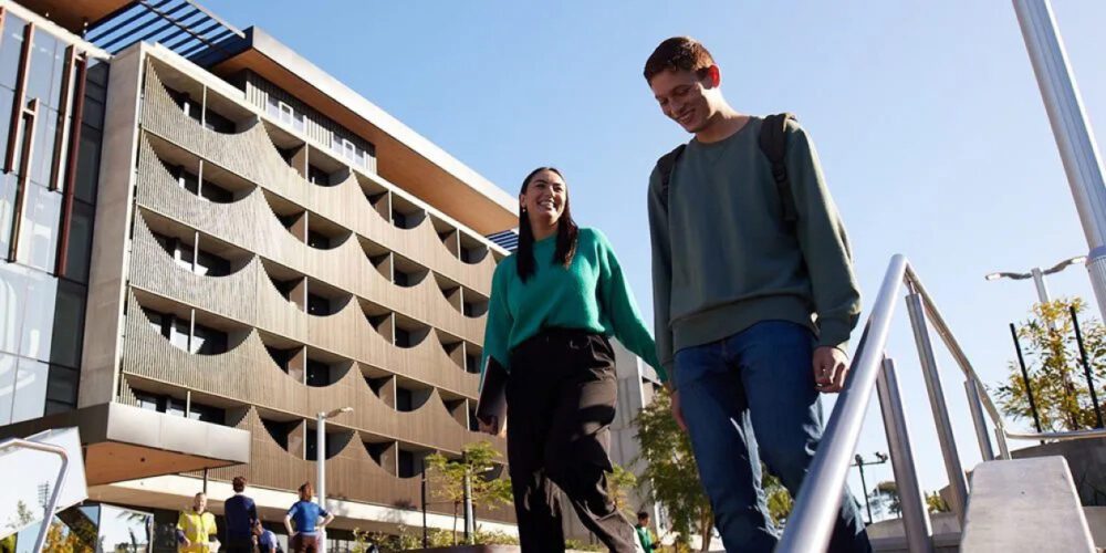 Two Vocational Education and Training (VET) students walking through the Bentley (Perth) Campus