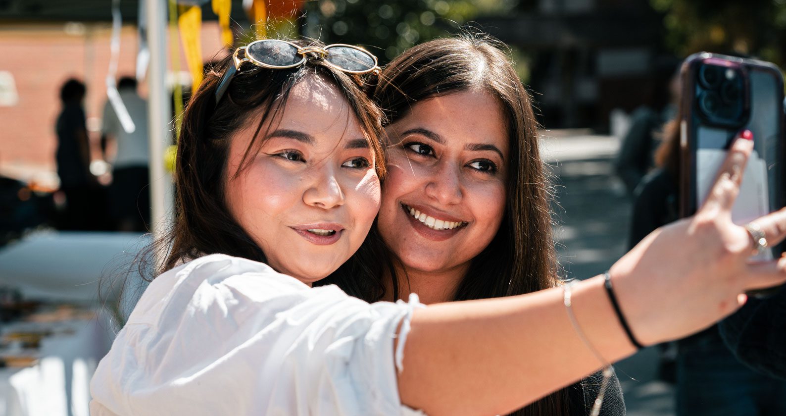 Devna taking a photo with a fan.