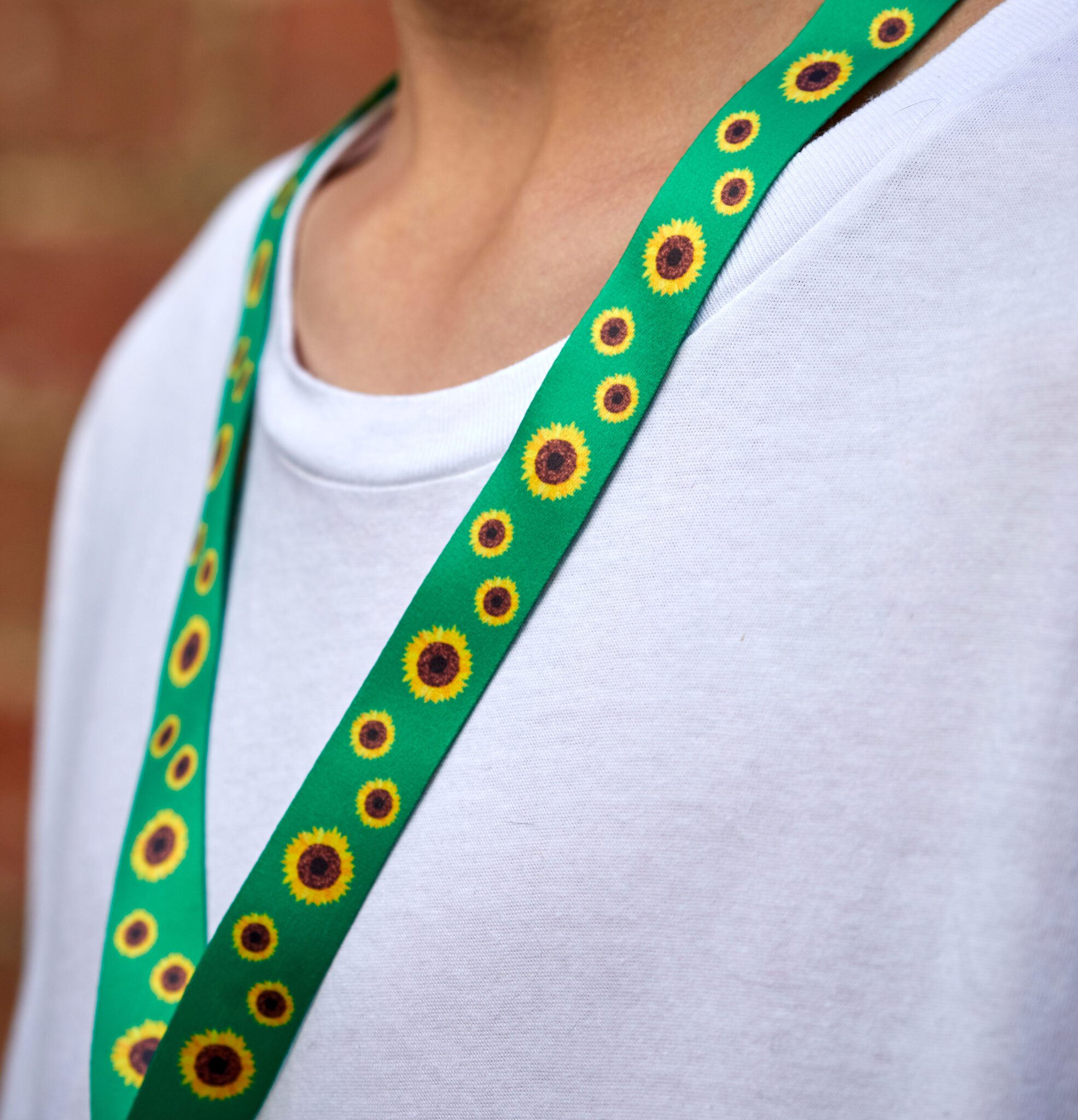 Person with sunflower lanyard