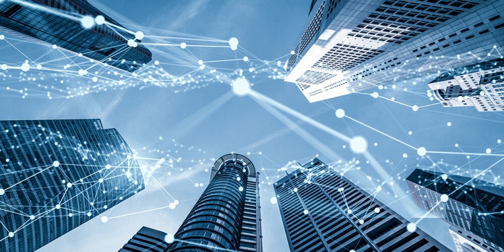 Towering smart city skyscrapers on the edges of frame and a representation of a digital connection across the image.
