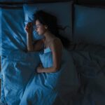 Woman sleeping in a bed,