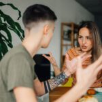 Two students fighting over a breakfast table.