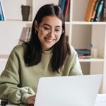 Student studying on a laptop.
