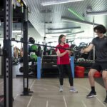 Person using equipment in gym