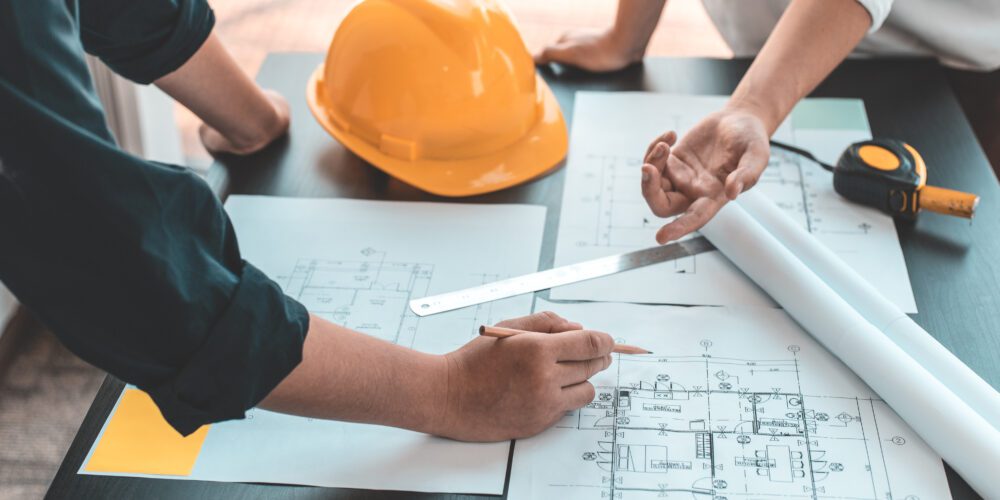 Meeting of engineers and architects in building planning.