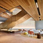 Photograph of inside Curtin's School of Design and the Built Environment, featuring a warm colour pallette.