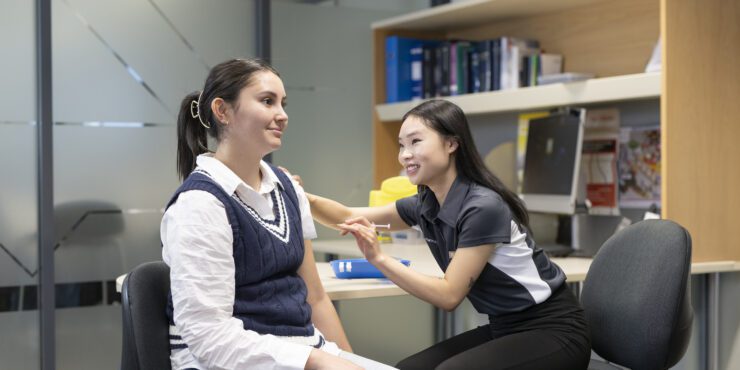 Pharmacy students practise client care.