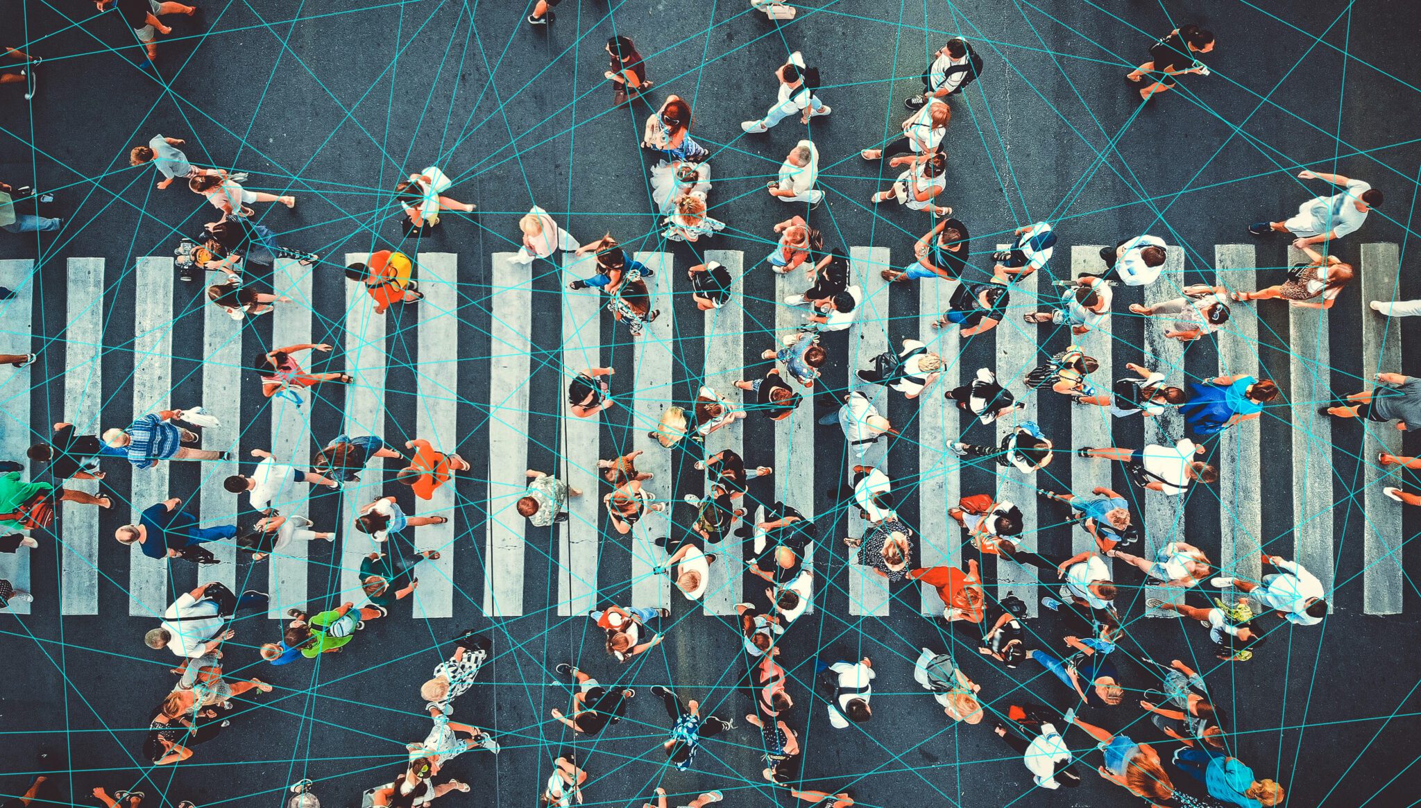 A busy pedestrian crosswalk overlaid with blue interconnecting lines.