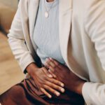 A women holding her stomach in pain