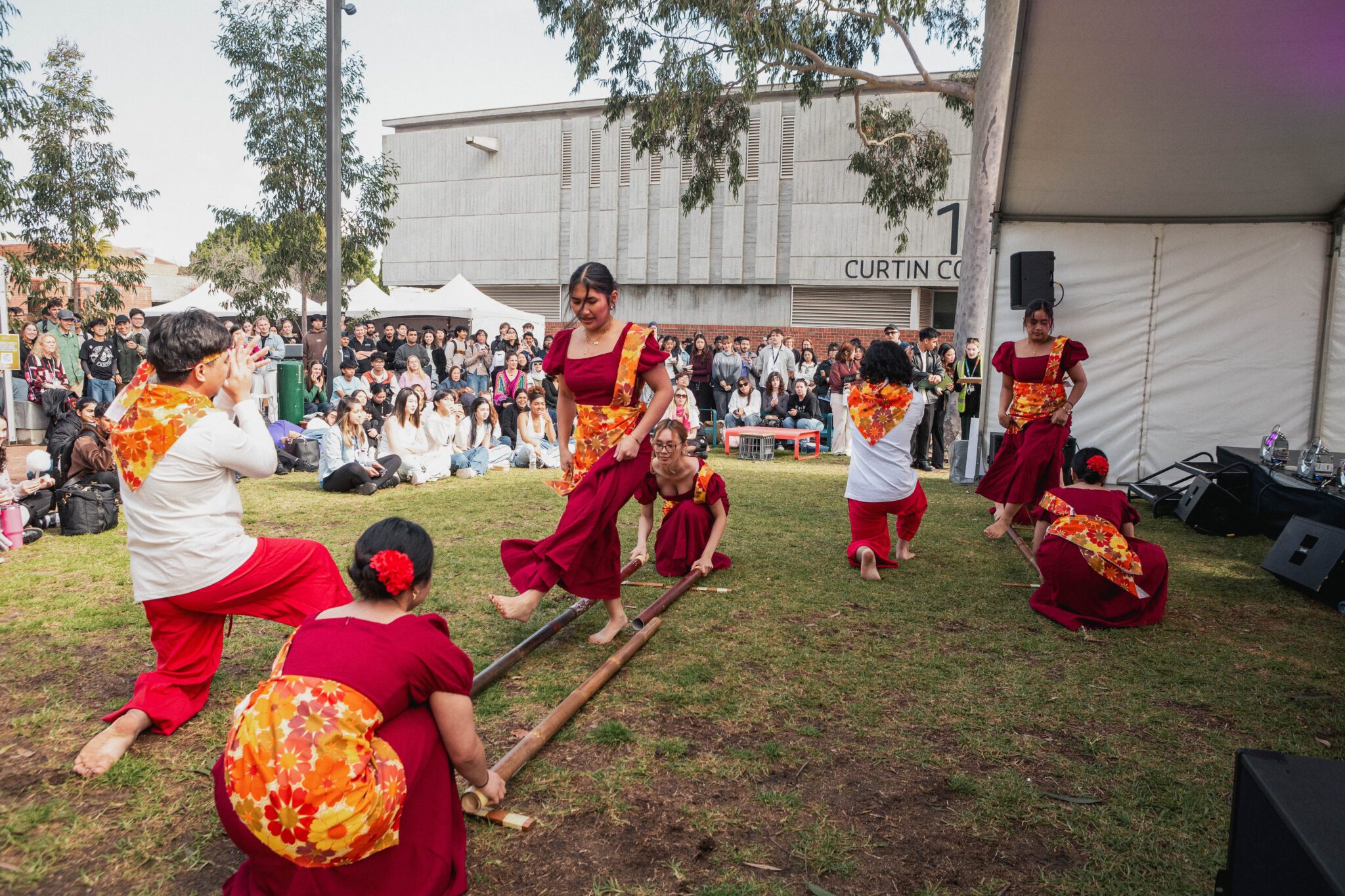 Image of students doing a traditional dance