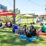 Students having a picnic at the creative quarters