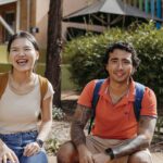 Two students sitting outdoors at Curtin Kalgoorlie campus