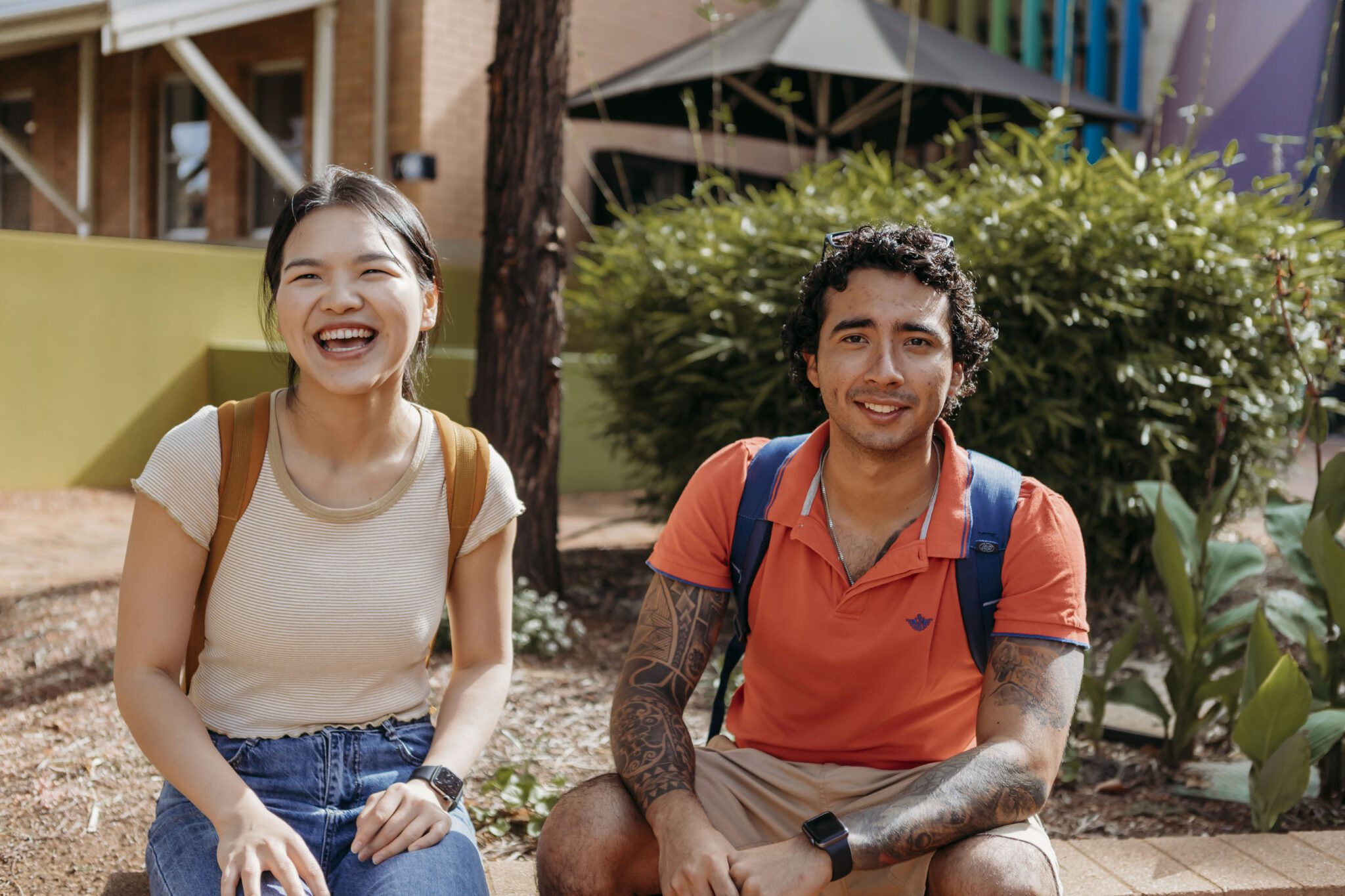 Two students sitting outdoors at Curtin Kalgoorlie campus