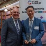 Minister presents Associate Professor Cheung his award