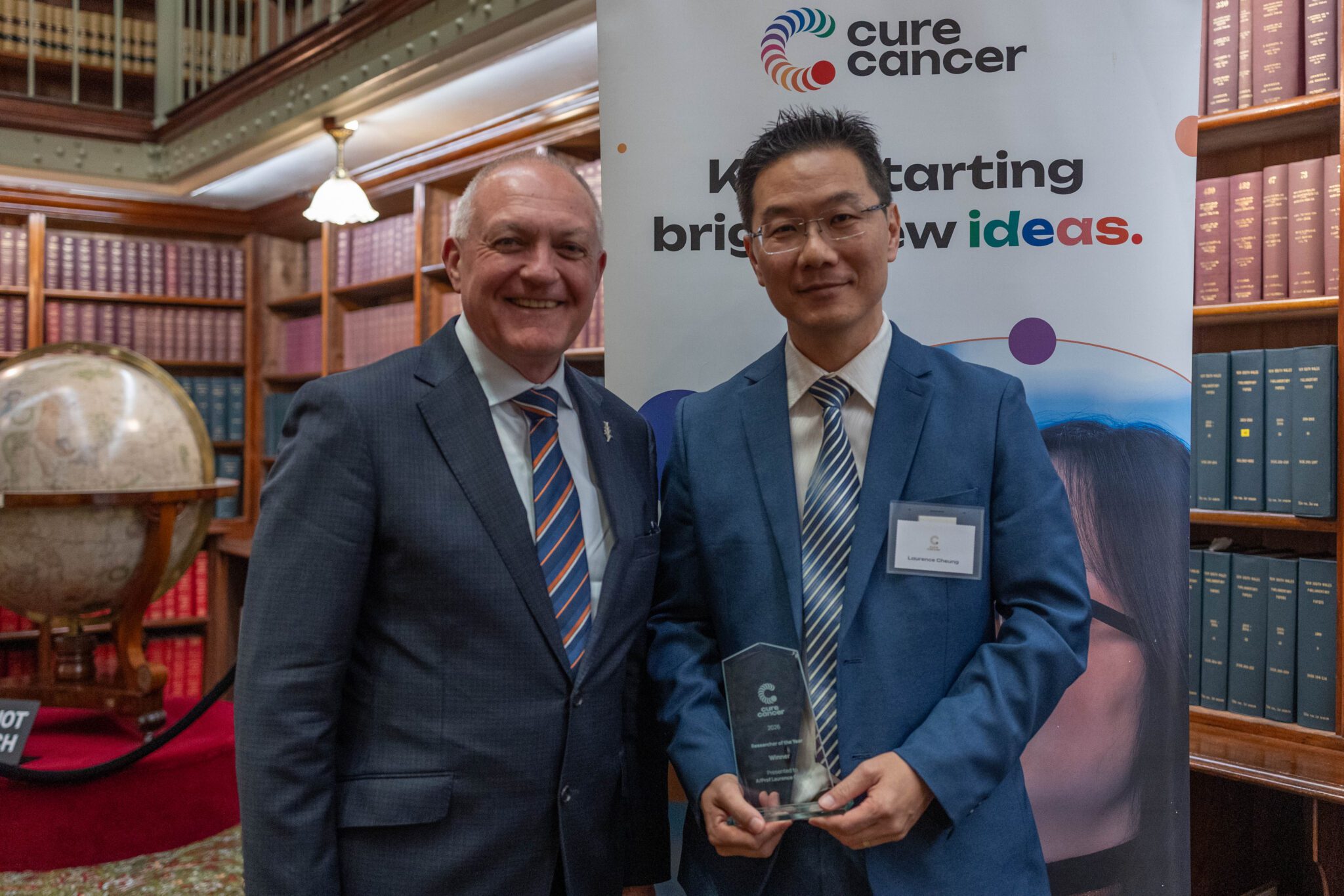 Minister presents Associate Professor Cheung his award