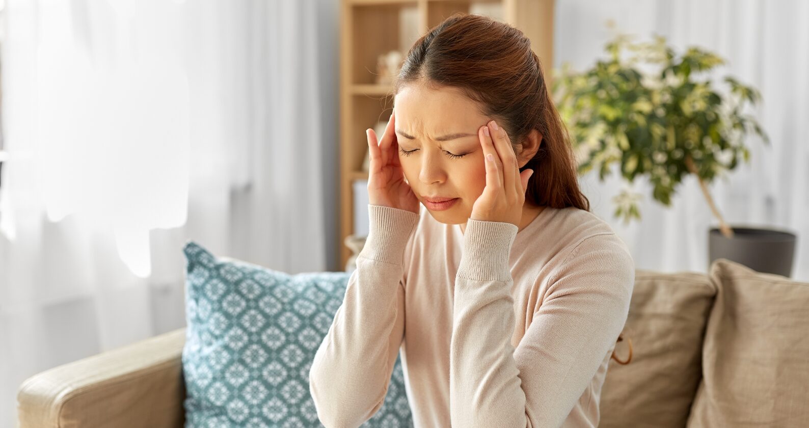 A person holding their head in pain