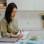 A girl writing on her notebook