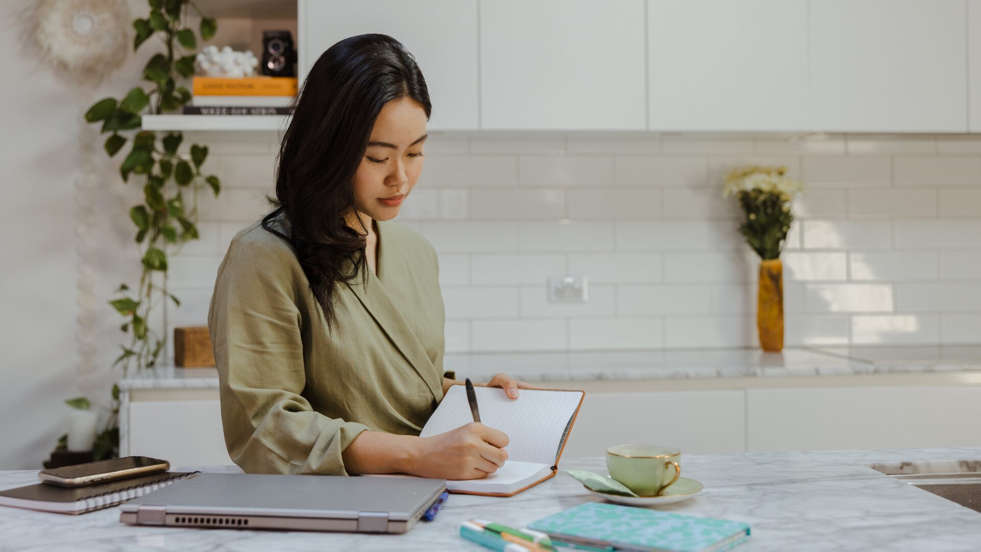A girl writing on her notebook