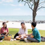 Student having a picnic on the beach