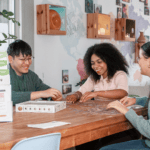 Three students talking at The Living Room space at Curtin