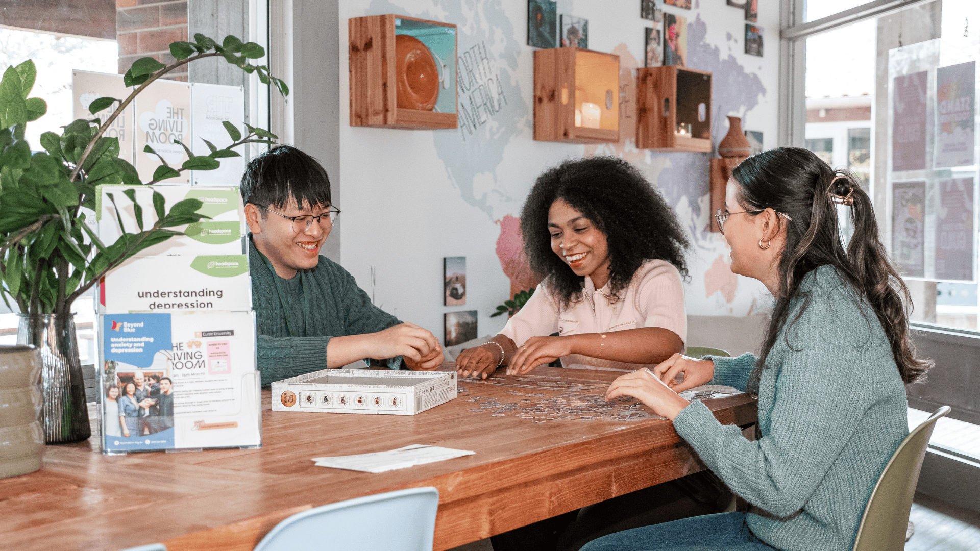 Three students talking at The Living Room space at Curtin