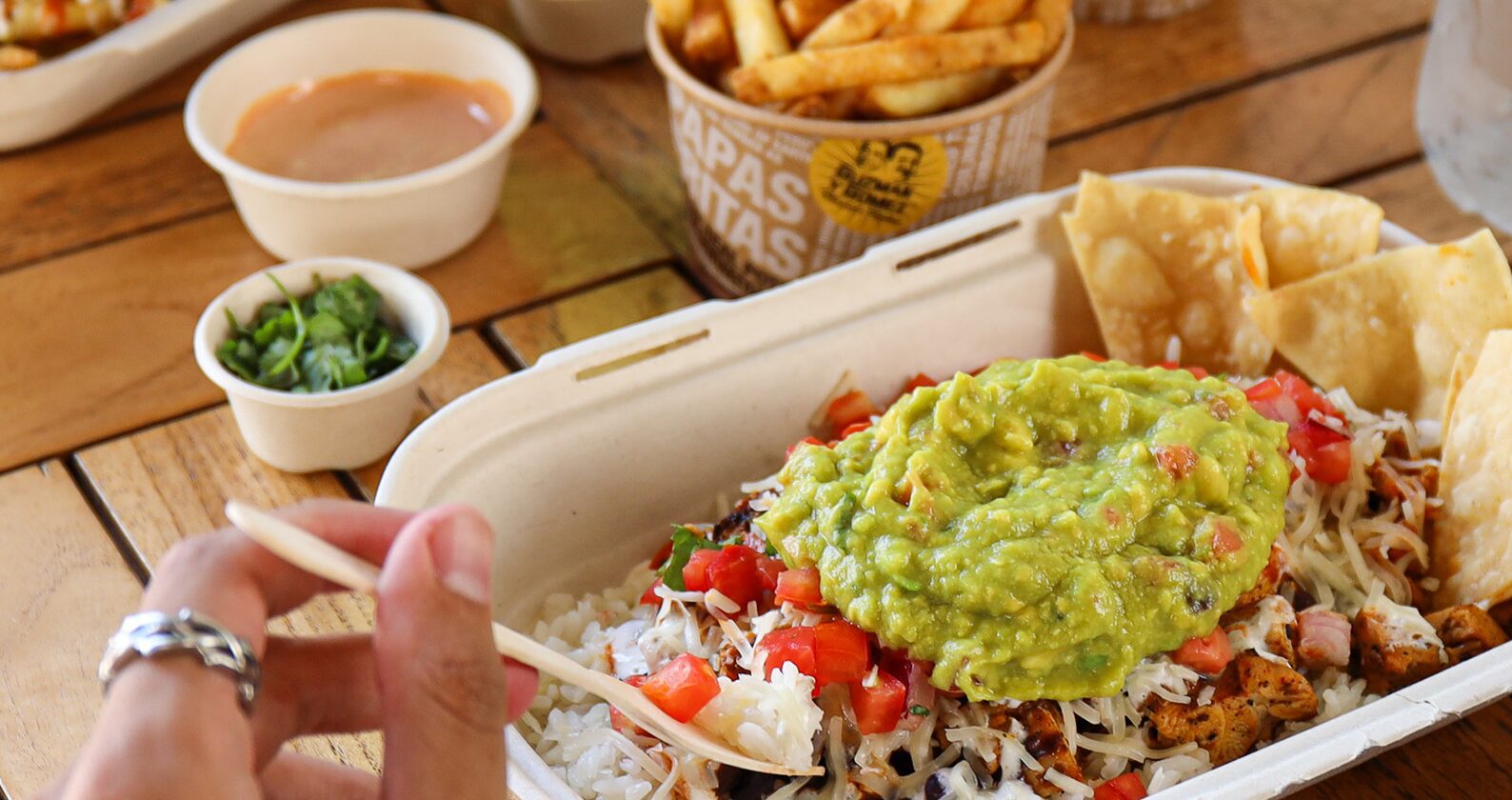 Person eating a burrito bowl