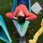 Students lying on hammocks.