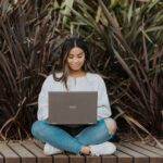 student using her laptop