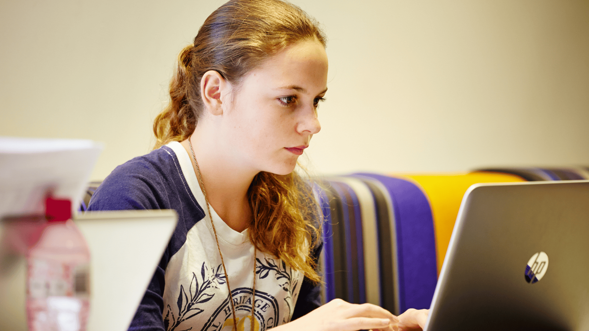 A girl looking at her laptop