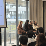 Panel discussion with industry professionals speaking to an audience at a career or networking event.