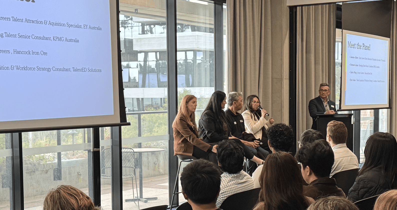 Panel discussion with industry professionals speaking to an audience at a career or networking event.