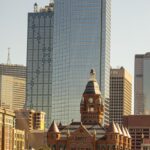 Scenic view of Dallas skyline featuring the Old Red Museum and skyscrapers.