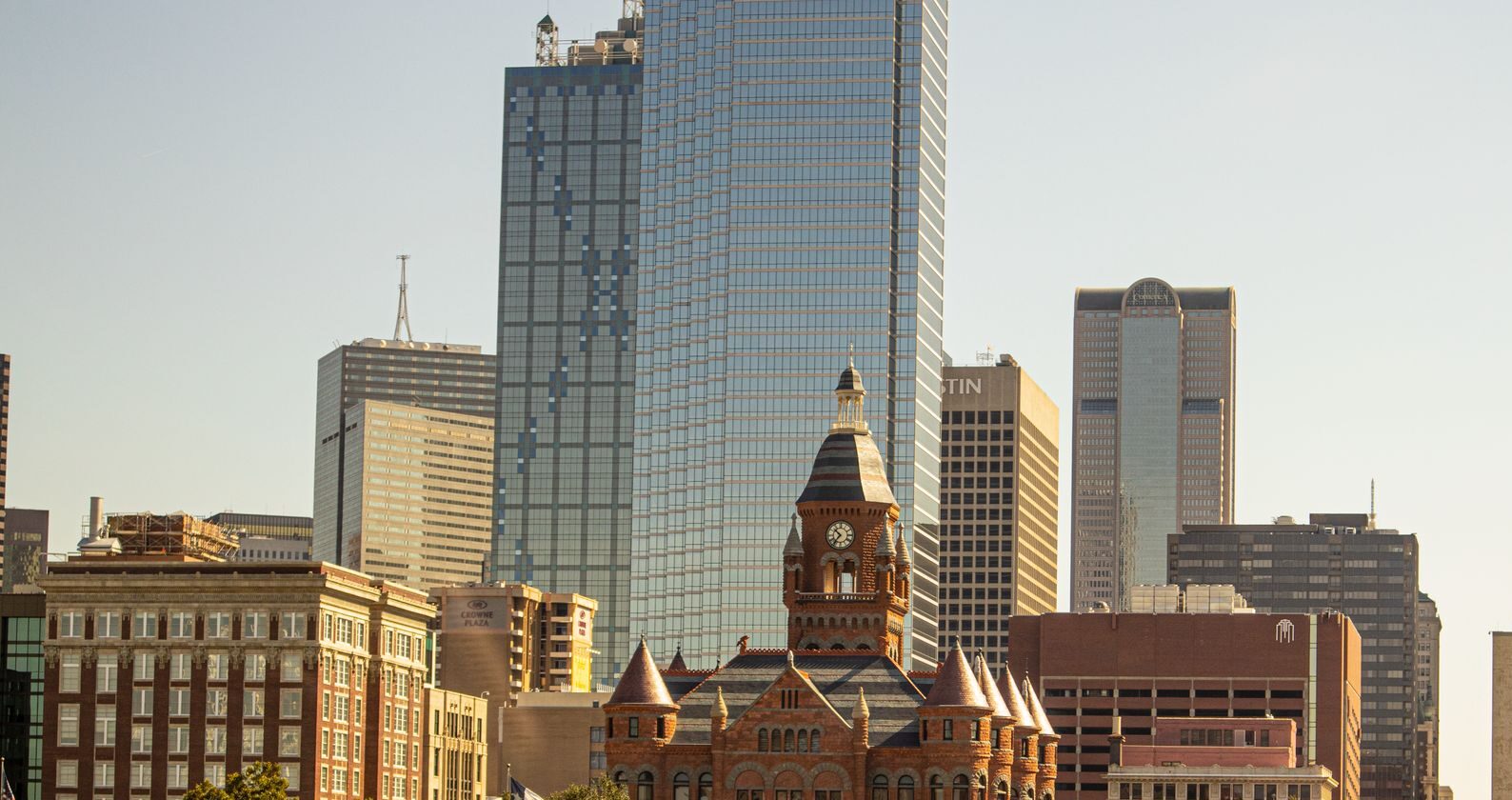 Scenic view of Dallas skyline featuring the Old Red Museum and skyscrapers.