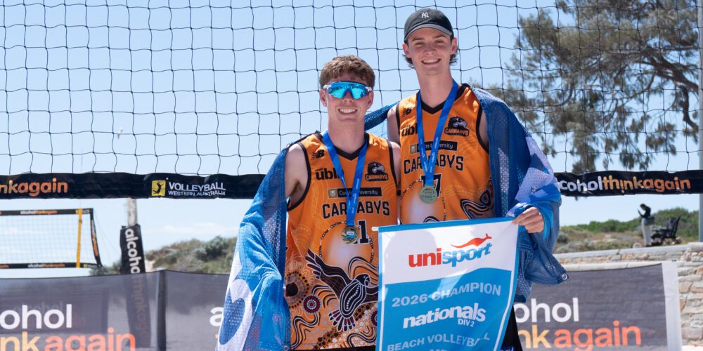 Beach volleyball players with medals