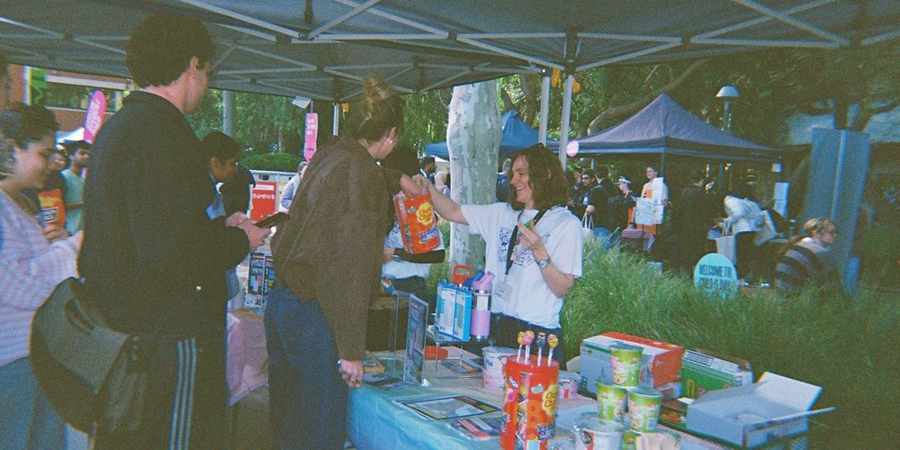 A sudent receiving a prize at the Try it Tuesday stall on O-Week at Curtin Perth.