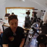 Image of three people making coffee at a van
