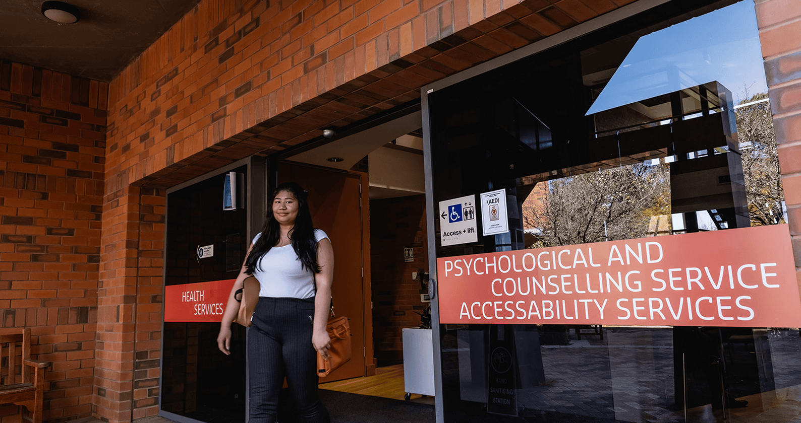 Person outside Curtin Psychological and Counselling Service and AccessAbility Services.